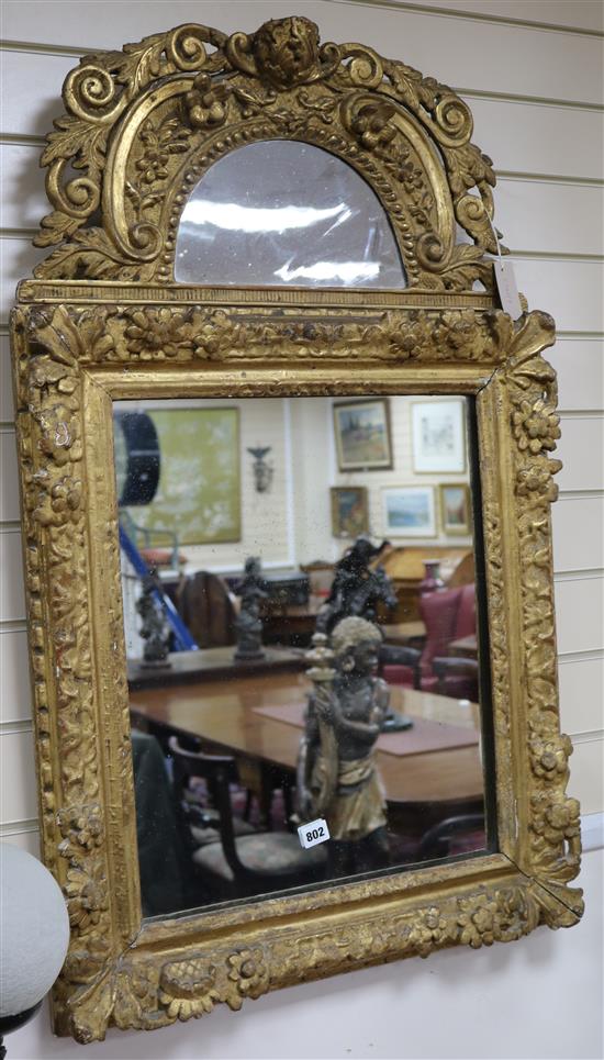 An 18th century giltwood and gesso wall mirror H.100cm